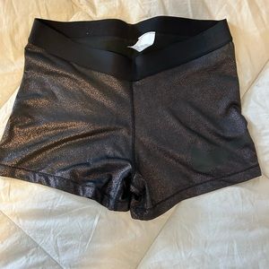 Size XL Nike shimmer spandex. Nike logo on the side. Never worn.